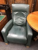A Himolla green leather manual reclining armchair