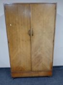 An Edwardian double door compactum double door wardrobe