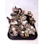 A tray of a large quantity of assorted plated wares to include cutlery, teapot, candlestick,