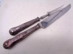 A carving set with silver handles.