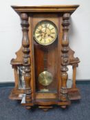 A 19th century mahogany Vienna wall clock with side mirrors