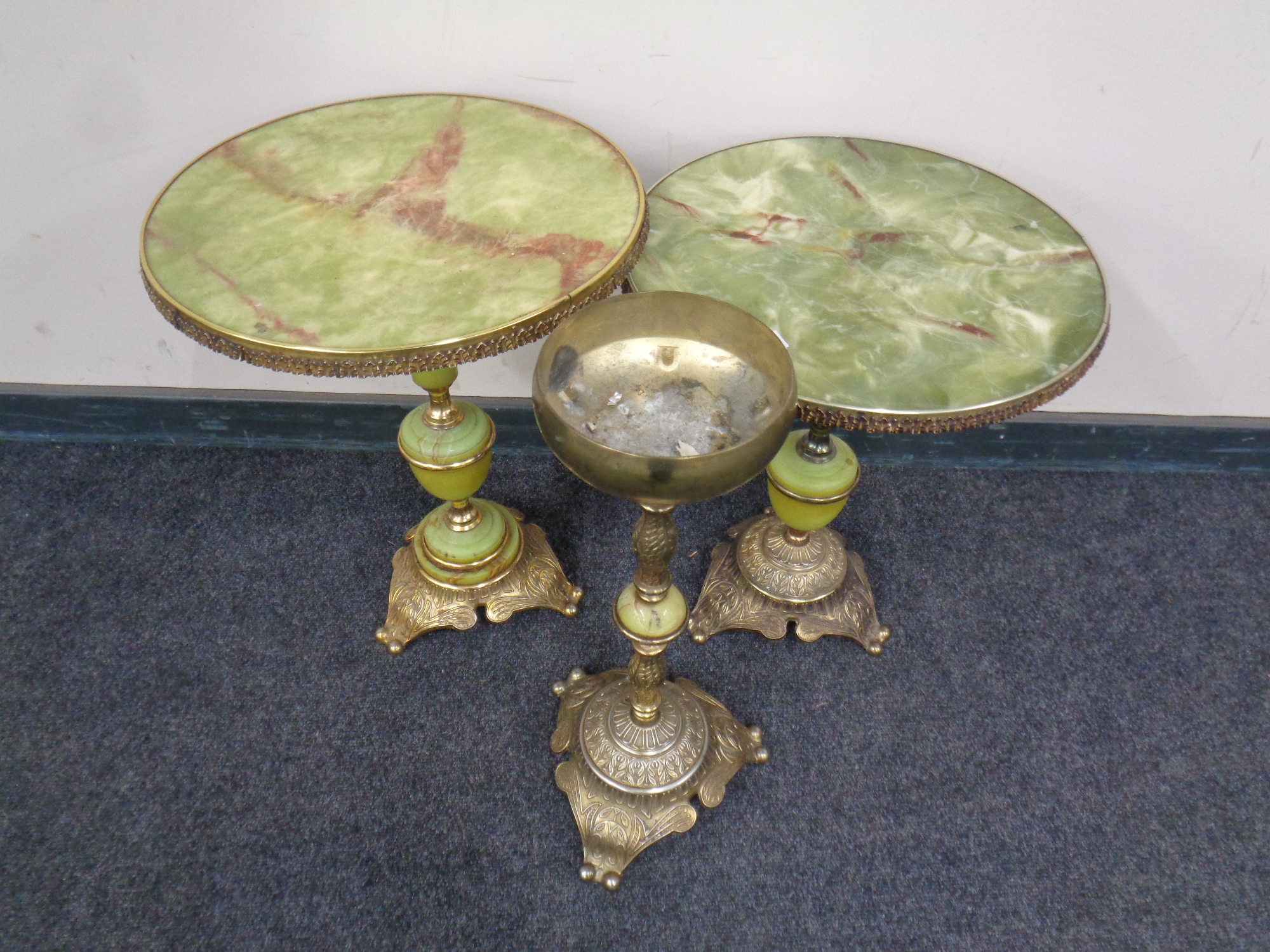 Two gilt and onyx effect wine tables together with a matching smokers stand