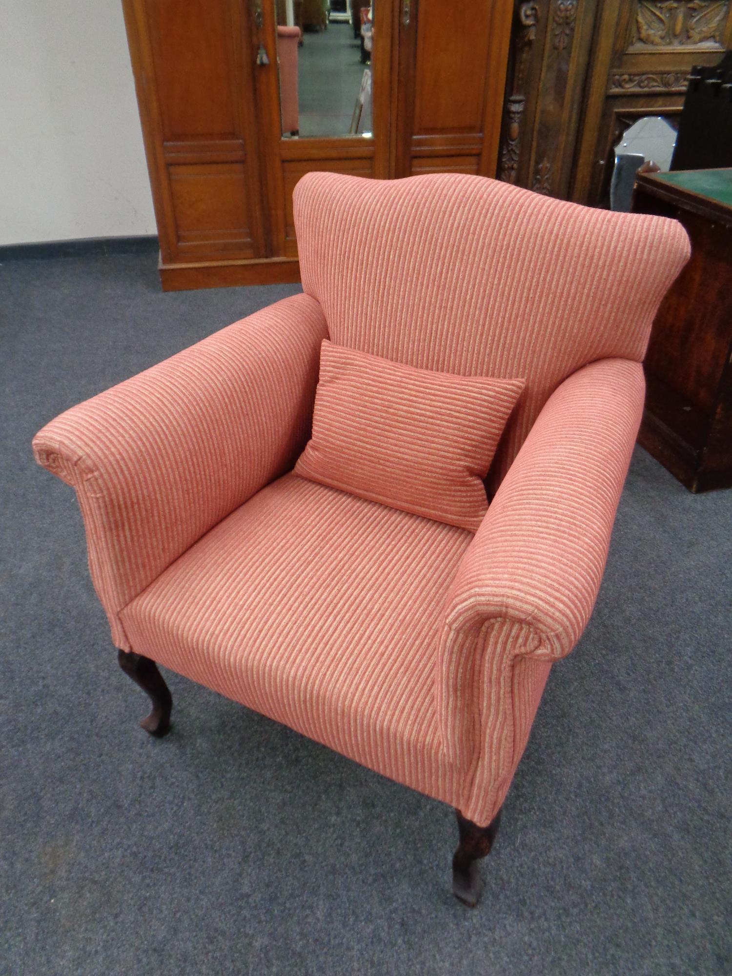 A 19th century armchair on beech cabriole legs (re-upholstered)