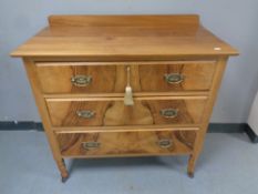 An Edwardian satin wood three drawer chest