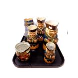 A tray of five antique Royal Doulton Lambeth character jugs together with a further Royal Doulton