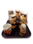 A tray of five antique Royal Doulton Lambeth character jugs together with a further Royal Doulton