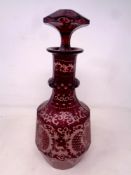 An antique Bohemian ruby glass decanter with stopper, height 32.5 cm.