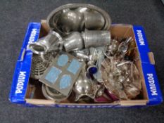 A box containing a large quantity of assorted metalware to include plated cruet and tea ware,
