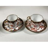 A Royal Crown Derby Imari Scissors pattern coffee cup and saucer set,