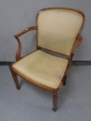 A 19th century mahogany and beech armchair upholstered in a gold fabric
