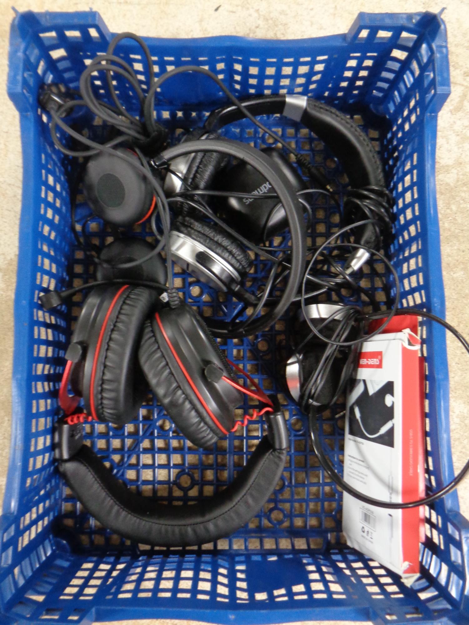 A basket containing headphones by Goodmans,