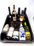 A tub of ten bottles of alcohol to include Courvoisier Cognac, wines, Baileys,