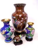Three Japanese cloisonne vases, graduated sizes on wooden stands,