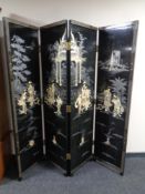 A Japanese lacquered and mother of pearl inlaid four-fold screen