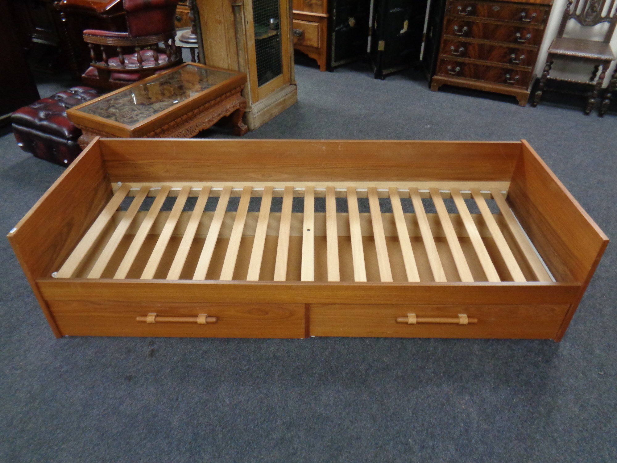 A continental teak day bed