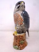 A Beswick Whyte & Mackay Peregrine Falcon decanter containing The Dalmore 12 Year Old Scotch Whisky,