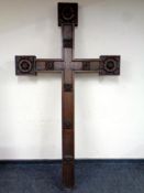 An impressive 19th century carved oak crucifix, each tip of the cross with Yorkshire Rose carvings,
