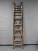 A vintage wooden folding step ladder