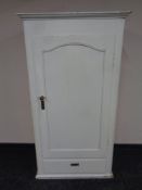 An antique continental painted pine hall cupboard fitted drawer beneath