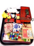 A tray containing a quantity of glass marbles, vintage tin plate toys, ceramic money boxes,