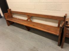 A pitch pine church pew, length 296 cm.