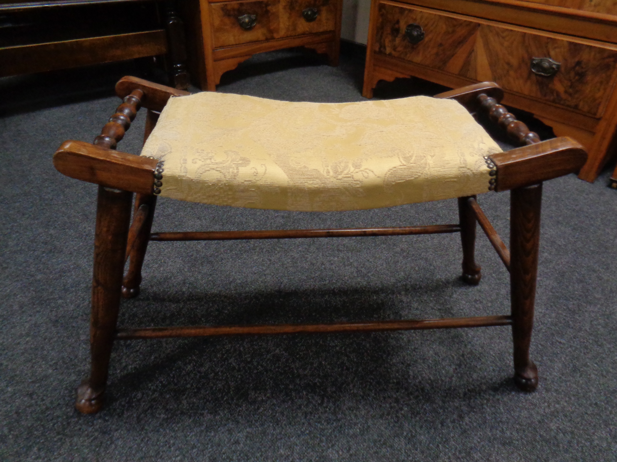 A beech stool with curved seat