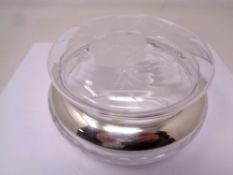 A continental silver rimmed glass jar.