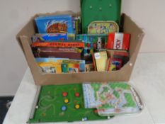 A box of vintage board games, playing cards,