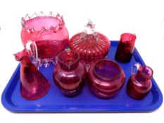 A tray containing seven pieces of antique cranberry glassware to include lidded pot, vase,