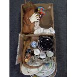 Two boxes containing antique and later wall plates, a wooden articulated snake,