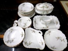 Twenty-five pieces of continental white floral gilt rimmed dinner china