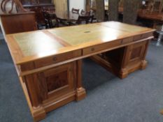 A good quality Barker and Stonehouse twin pedestal partners desk with leather inset panels and