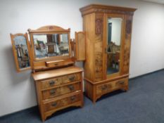 An Edwardian burr walnut mirrored door wardrobe with matching three drawer dressing table