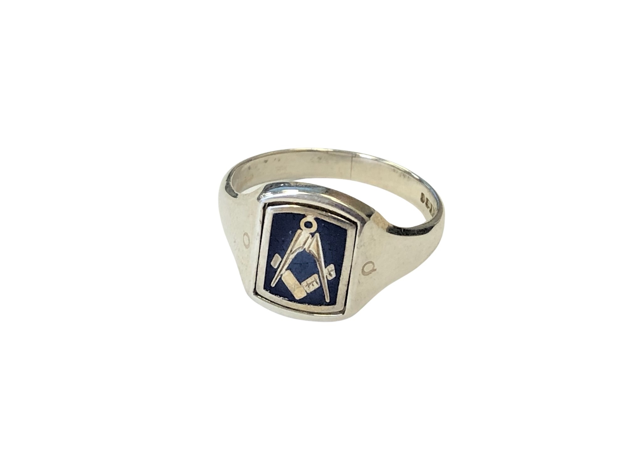 A silver masonic ring with swivel head