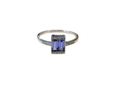 A 9ct white gold tanzanite baguettes and diamond ring, size O/P.