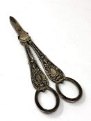 An ornate pair of Victorian silver candle snuffers,