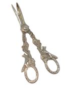 A very ornate pair of silver grape scissors depicting foxes.