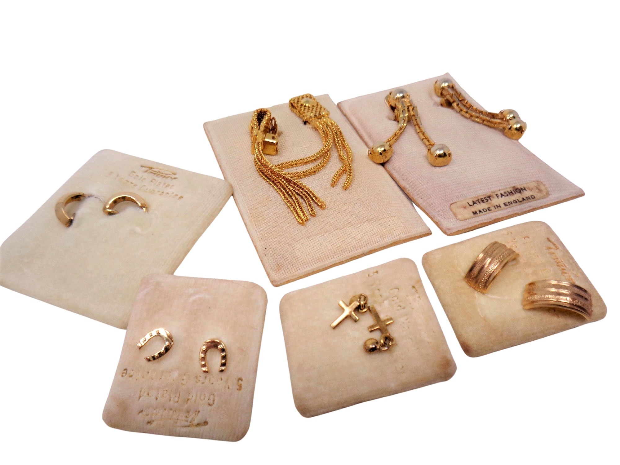 Six pairs of gold plated earrings