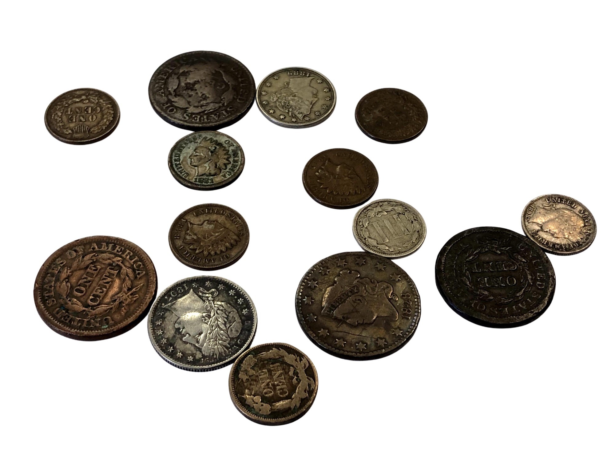 A collection of American coins including various pennies, 1897 quarter dollar,