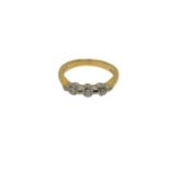 An 18ct gold three stone diamond ring, size K1/2 CONDITION REPORT: 3.