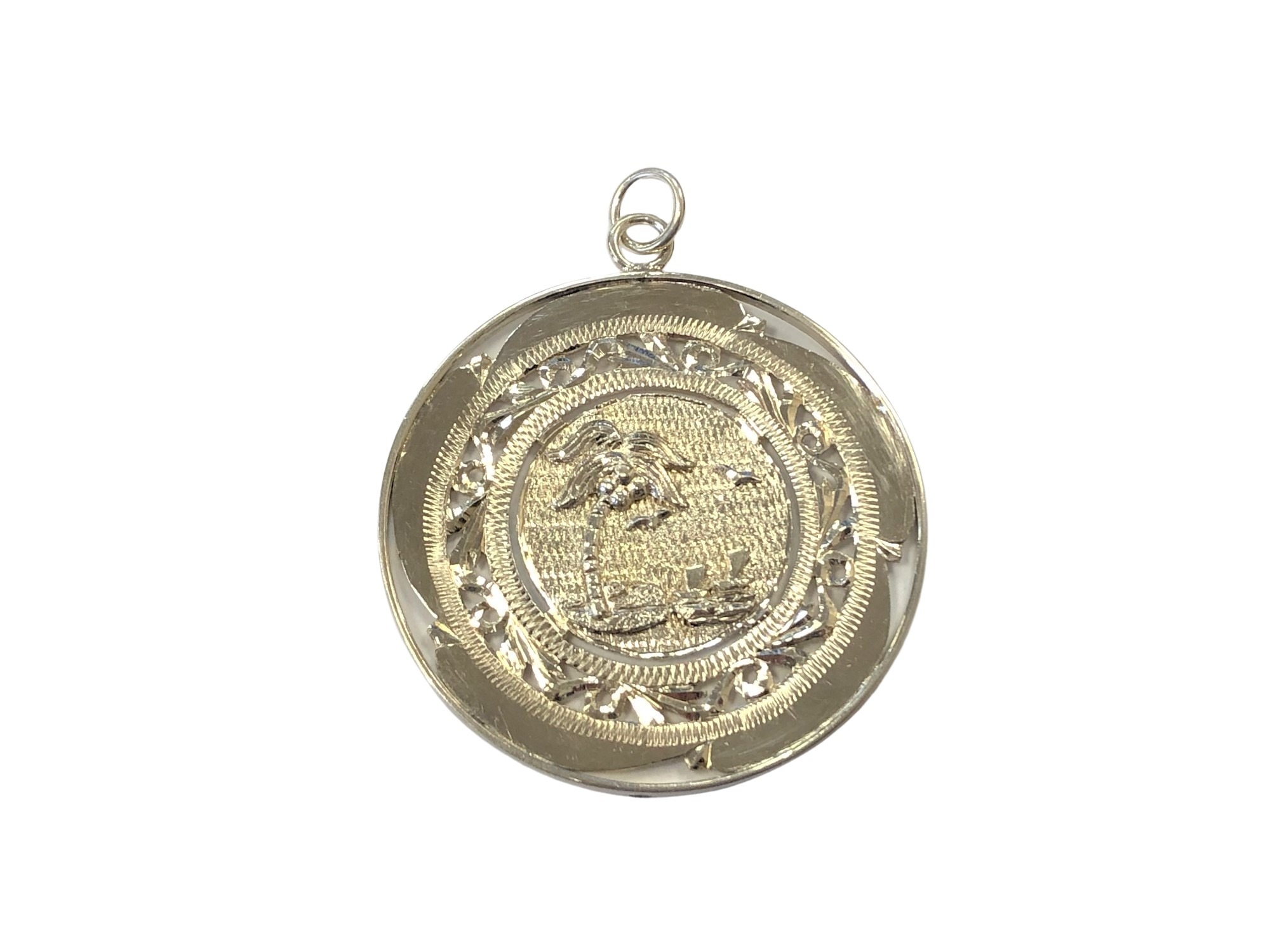 A large circular silver pendant