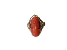 An antique gold coral cameo ring