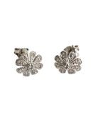 A 9ct white gold diamond set flower stud earrings