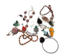 A collection of mostly white metal and silver jewellery, bangles, pendants etc.