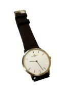 An 18ct yellow gold Gentleman's Baume & Mercier wristwatch with brown leather strap,