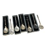 A collection of seven silver apostle spoons each showing a different saint (five boxed)