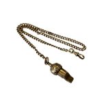 An antique yellow metal Albert chain and whistle, stamped .