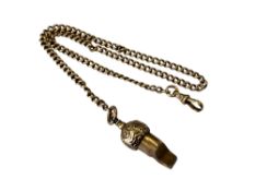 An antique yellow metal Albert chain and whistle, stamped .
