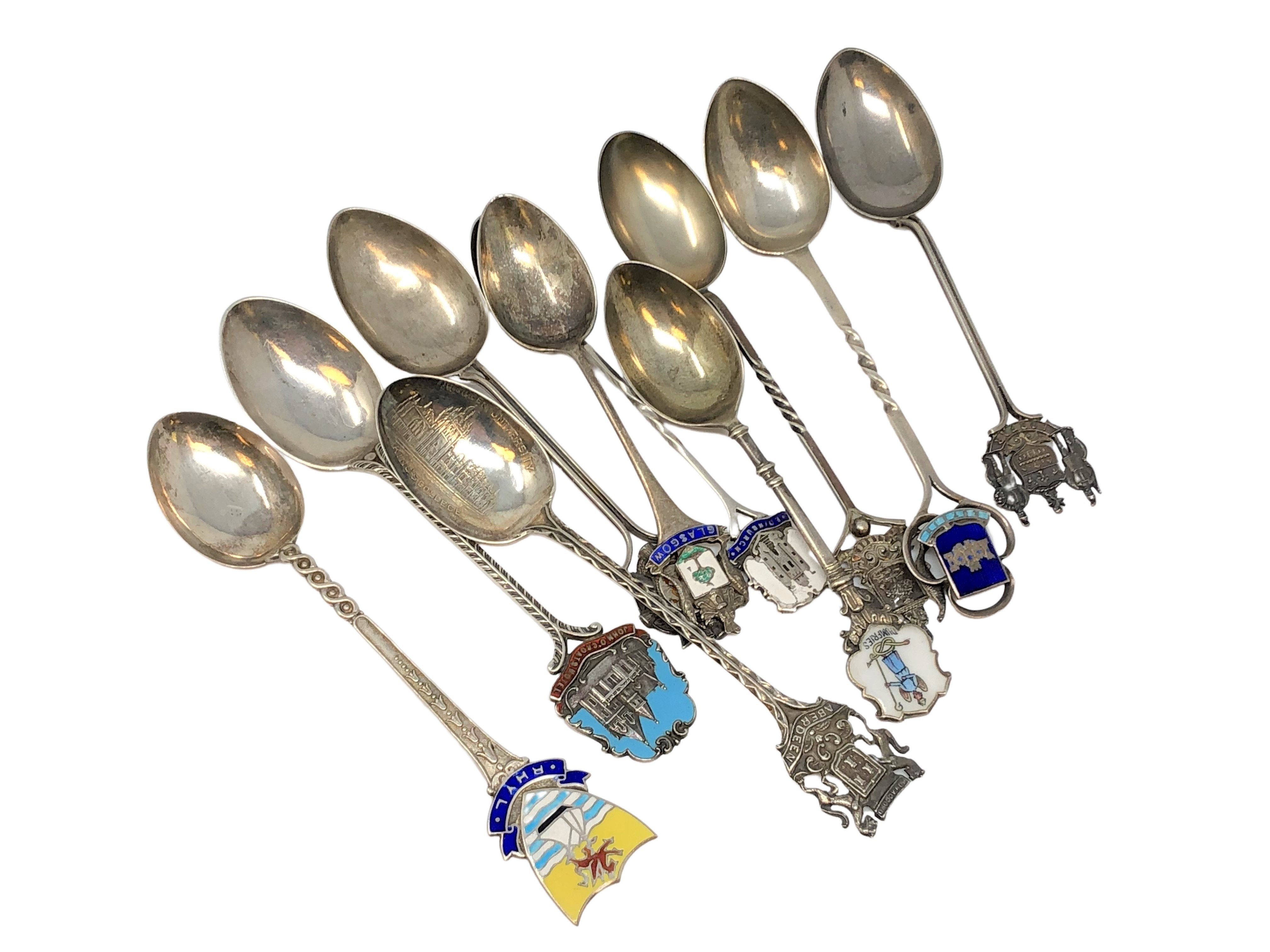 A collection of silver and enamel Scottish, Welsh spoons, Glasgow, Forfar, Dumfries, Edinburgh,