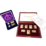 A collection of silver gilt stamps in two boxes.